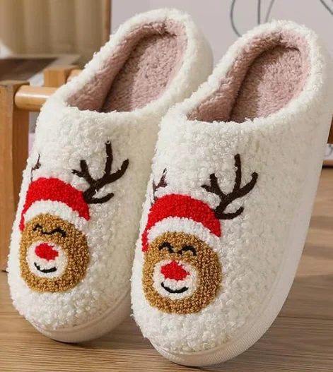 Cream fleece reindeer slippers with Santa hats, one of the free holiday slipper giveaways at the Building Safety Solutions booth at IAEM 2026